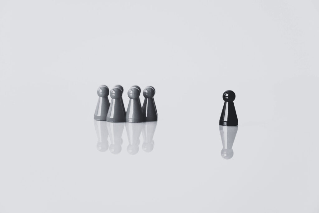 Small group standing apart showing leadership concept