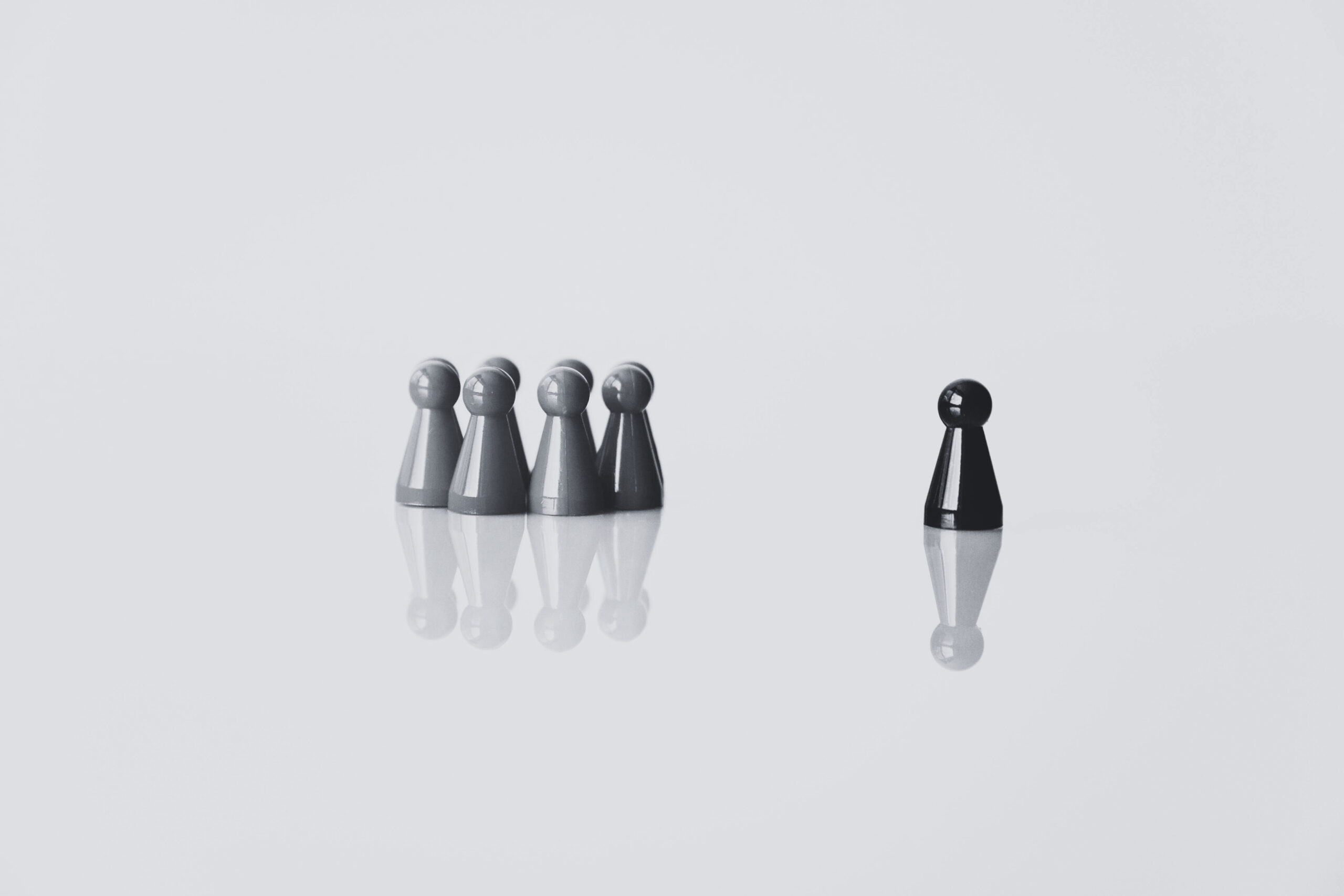 Small group standing apart showing leadership concept